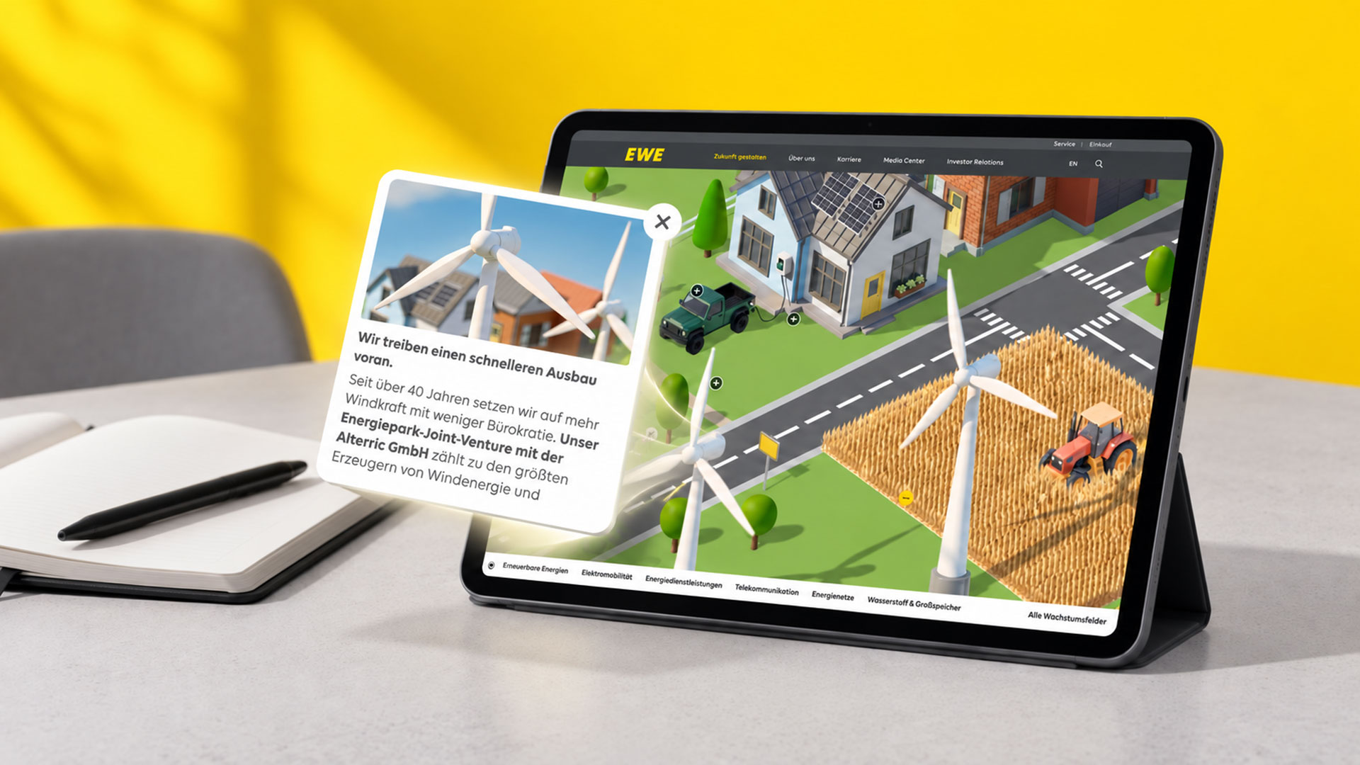 EWE-Bildwelt auf einem Tablet mit Windrädern, Quartier und Informationsfenster