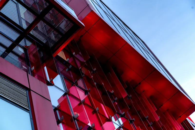 Red glass façade of the office building at Spielbudenplatz in Hamburg